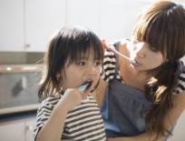 mother and child brushing their teeth