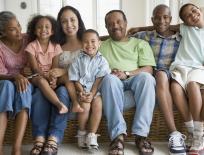 large family sitting on a sofa