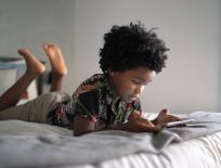 boy looking at a mobile phone