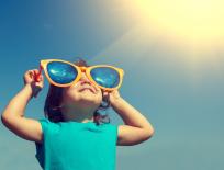 child wearing big sunglasses