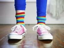 child wearing colourful socks and shoes