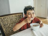 Boy eating a bowl of cereal