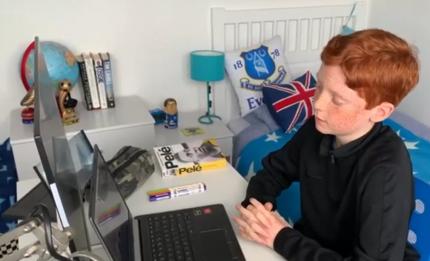 Boy sitting at computer