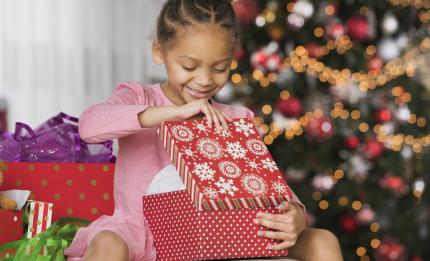 Girl opening a Christmas present