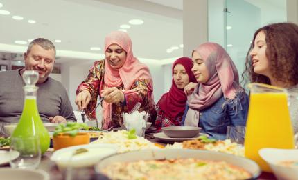 Muslim family sharing food