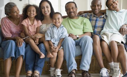 large family sitting on a sofa