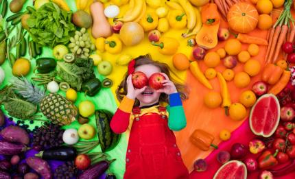 girl with different colour fruits and vegetables