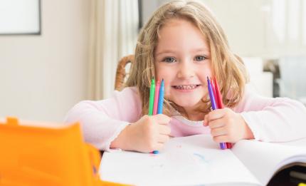 girl with pens, a notebook and pencil case