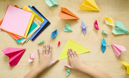 hands making origami