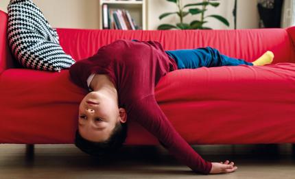 boy lying on the sofa