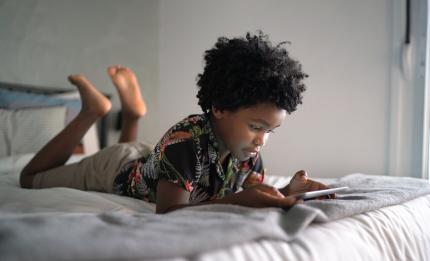 boy looking at a mobile phone