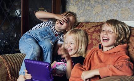 brother and sisters laughing