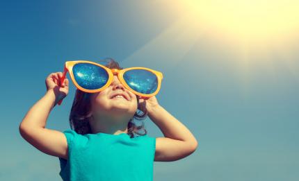 child wearing big sunglasses