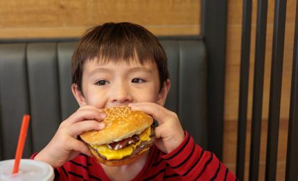 boy eating a burger