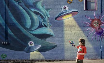 painting on a wall with monster and aliens