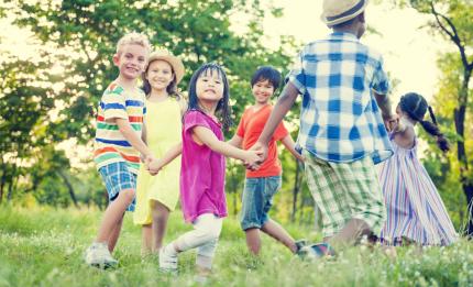 children holding hands in a circle