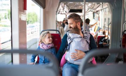 father and children on the bus