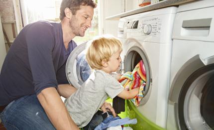 Dad and son doing laundry