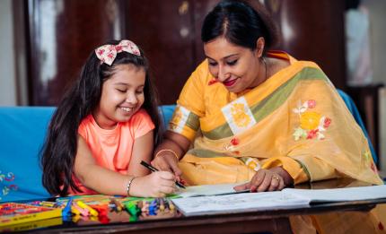 mother and daughter with a book