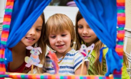 children playing with toy theatre