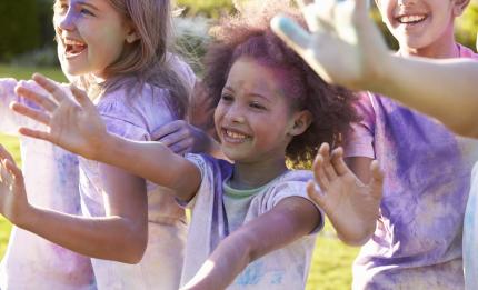 children covered in powdered paint