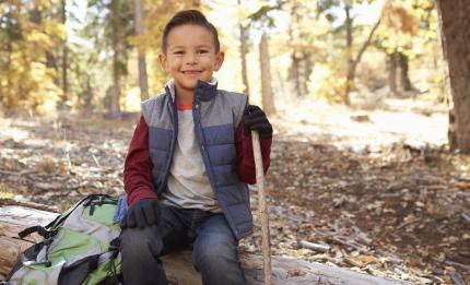 boy hiking in woods