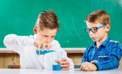 two boys doing science experiment