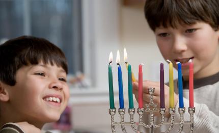 boys lighting candles