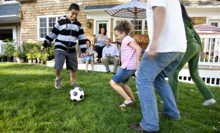 family playing football