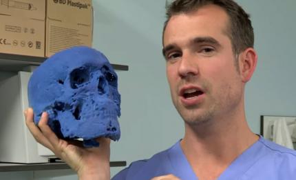 Man holding printed skull