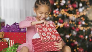 Girl opening a Christmas present