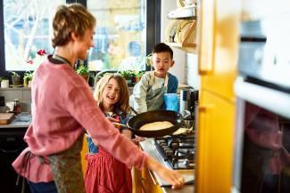 family making pancakes