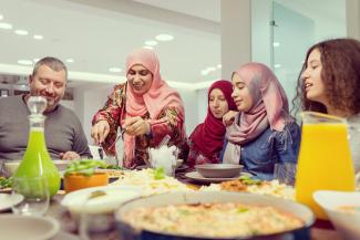 Muslim family sharing food