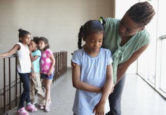 bullied girl with teacher