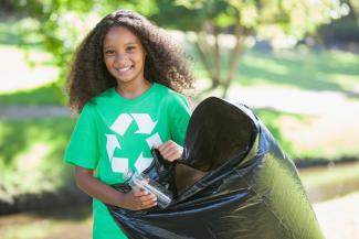 girl with a recycling bag