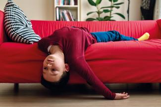 boy lying on the sofa