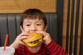 boy eating a burger