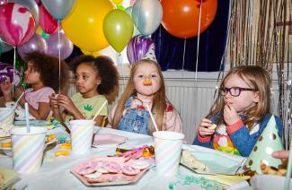 children eating at a birthday party