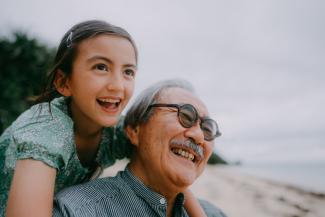 happy grandfather and granddaughter