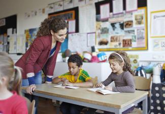 teacher and two schoolchildren