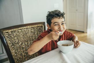 Boy eating a bowl of cereal