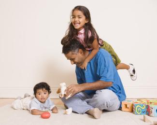 dad with baby and girl