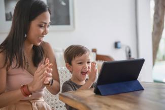 woman and boy clapping 