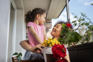 mother and daughter on balcony