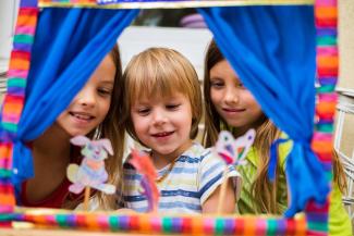 children playing with toy theatre