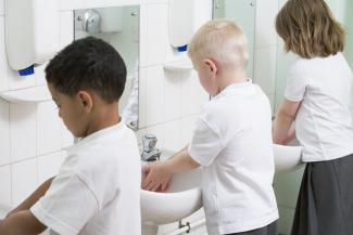 children washing their hands