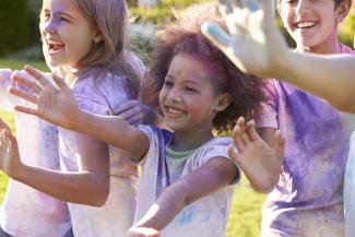 children covered in powdered paint