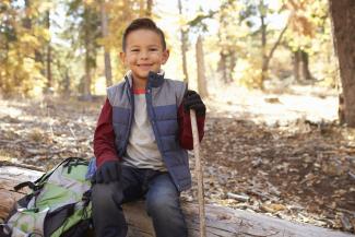 boy hiking in woods