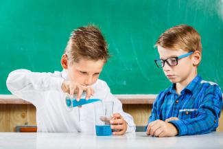 two boys doing science experiment