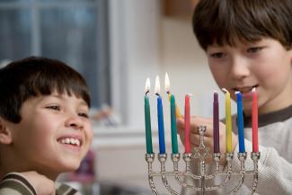 boys lighting candles